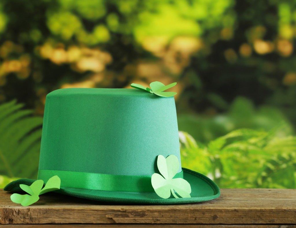 Green hat and paper clovers