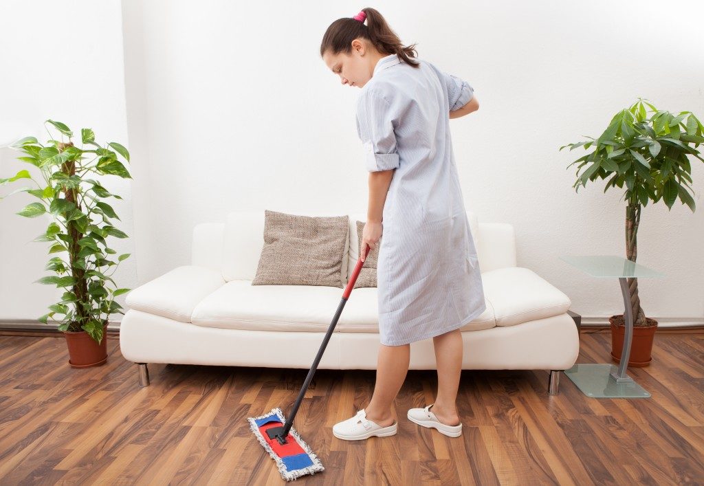 Maid cleaning the floor