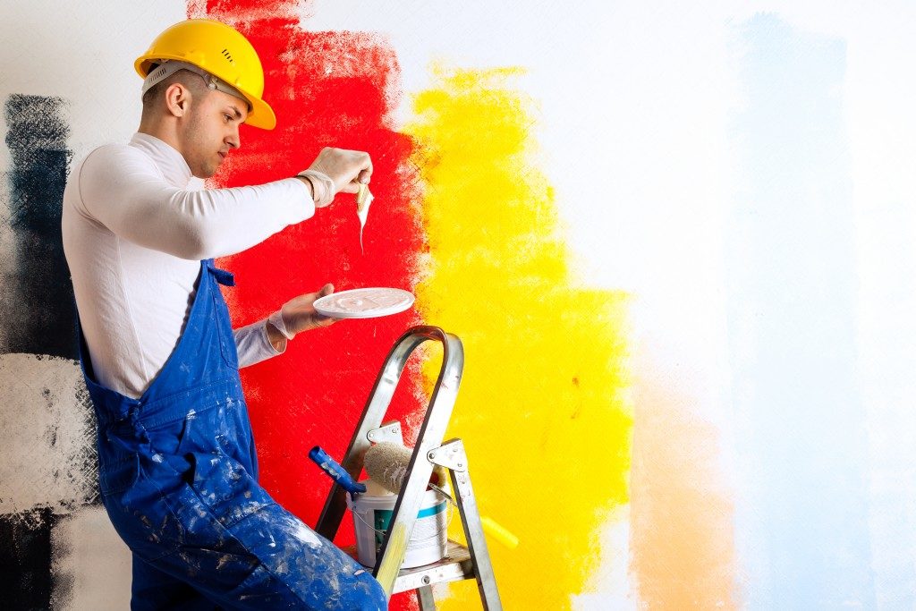 Painter working with paint